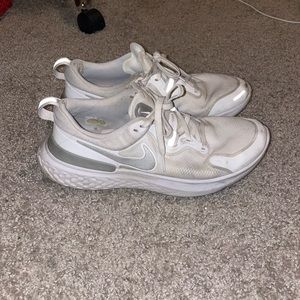 Worn White Nike Tennis Shoes